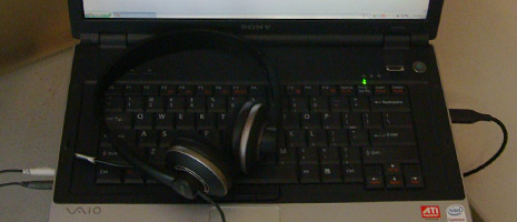 laptop keyboard and headphones