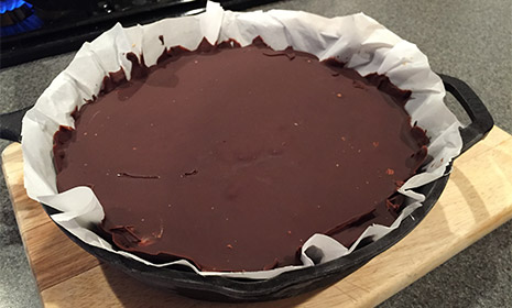 A chocolate peanut butter cup in a Lodge cast iron pan