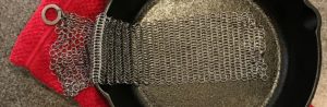 Chainmail scrubber for cleaning cast iron pans
